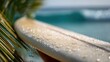 © filmanana - Surfboard and ocean in focus with fresh droplets, tropical palm edge, calm anticipation before the wave, minimal seascape style for summer beach lifestyle, sport, travel ads with bokeh copy
