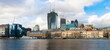 © Mint Images - River Thames and the North Bank skyline, buildings of the City of London, a historic waterfront with modern buildings of the financial downtown district behind.