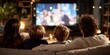 © YanabY - Family enjoyment during cozy movie night at home with warm lighting and a large screen