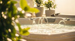© antusher - Outdoor hot tub with bubbling water jets surrounded by green plants on a sunny day