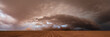 © Mint Images - A supercell, a severe warning storm, a sky with dramatic dark clouds sitting on the horizon.