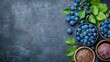 © lililia - Vibrant beets, plump grapes, and flax seeds are elegantly laid out on a dark surface, showcasing the rich colors and textures of each ingredient