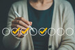 © Pixel Studio - Woman using a stylus to select options on a digital checklist with checkmarks showcasing task completion and digital workflow in a modern and efficient manner for productivity and organization