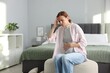 © New Africa - Pregnant woman suffering from nausea in bedroom. Space for text