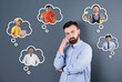 © New Africa - Young man thinking about career options on grey background. Thought bubbles with people of different occupations around him. Choice of profession