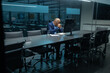 © Anastasiya - Mature African American businessman sitting with head bowed in a quiet meeting room, showing exhaustion or deep concentration. Corporate stress and workplace pressure reflected clearly