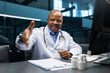 © Anastasiya - Mature African American doctor greeting with a handshake in his office. Friendly medical professional welcoming a patient with confidence and warmth in a clinical environment