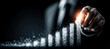 © Avelino - Businessman hand creating glowing bar chart growth