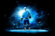 © 103tnn - Hockey. Hockey players on a beautiful black background with a flash of light behind them. Isolated on a black background. Sports
