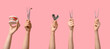 © Pixel-Shot - Female hands with dental tools and jaw model on pink background