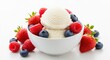 © Farhan - White bowl of vanilla ice cream scoops topped with fresh raspberries blueberries and strawberries on white table