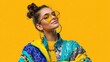 © mila103 - A woman wearing a yellow and blue jacket and sunglasses. She is smiling and looking at the camera