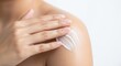 © Tapasma - Hand rubbing lotion on shoulder