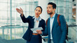 © FlexOn/peopleimages.com - People, gate agent and direction with traveler, boarding pass or ticket for assistance in airport. Man, woman or attendant helping customer with instruction for travel, departure or flight service