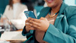 © FlexOn/peopleimages.com - Business woman, hands or typing with phone in meeting, review agenda or research info for board gathering. Online resources, digital programme or manager prepare for workshop, multitasking or person