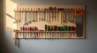 © photoplotnikov - Organized tool board displaying wrenches, screwdrivers, and hand saw in a workshop