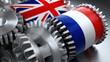 © JAYDA RIN - Metal gear wheels with British and French flag colors symbolizing cooperation and industrial partnership in mechanical setting