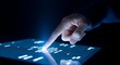 © Ideate Design 028 - Hand interacting with futuristic digital interface on dark background