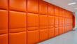 © Natalia - Orange soft artificial leather wall panel, textured surface background.