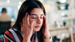 © peopleimages.com - Tired, woman and headache in office with massage for burnout, workload pressure and marketing crisis. Bokeh, female person or coworking with migraine, advertising job fatigue or tension in workplace.