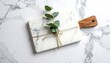 © Sepatu - Marble board with branch on marble backdrop