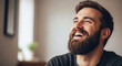 © Ksenia Pestereva - Portrait of man with beard participates in No Shave November, smiling broadly. Happy man grows facial hair for No Shave November, celebrating the month with a fun contest.