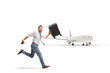 © Ljupco Smokovski - Passenger with a suitcase and passport and running to catch a plane
