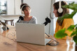 © Wavebreak Media - Diverse female coworkers recording podcast in kitchen studio using microphones and laptop