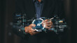 © PRIM - Businessman using smartphone with AI technology interface. Future digital data analysis and business strategy concept with virtual charts, network connection and modern growth graphs.