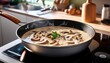 © Milla - creamy mushroom sauce simmering in a skillet over low heat in a modern kitchen