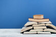 © lana_u - Open book, hardback colorful books on wooden table. Back to school. Copy space for text. Education business concept.