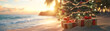 © linda_vostrovska - Decorated Christmas tree with colorful lights and gifts on the beach with palms, sea and sunset in the background. Concept of Christmas travel.