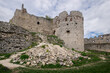 © Travel 'n' Lifestyle - View of the crumbling stone walls of Plavecky hrad castle rise against a cloudy sky, ruins scattered below, Plavecke Podhradie, Bratislava Region, Slovakia.