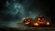 © Olena - Eerie Jack O' Lanterns: Sinister Carved Pumpkins Glowing in the Foggy Darkness for Halloween