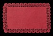© MakeStories.com - Red fabric rectangular lace placemat on black background