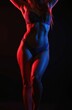 © Maryna - Fit woman in lingerie posing in red and blue neon lights against black backdrop. Her toned body features defined abs and smooth skin illuminated by contrasting colors.
