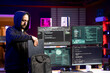 © DC Studio - Hacker packing laptop after finishing coding stealth malware to evade security. Evil man putting notebook in backpack after finishing work on script hiding malicious code from detection systems