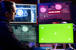 © DC Studio - Hacker getting system hacked popup alert on green screen mockup computer after using malware software. Rogue engineer at home using chroma key PC to hide online activity after stealing data