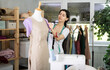 © JackF - Armenian fashion designer works with fabric on a mannequin, she checks the size of the sample and makes edits. Process of creating clothes