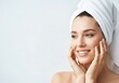 © Shamim Akhtar - Woman with towel on head smiling and touching her face