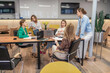 © svetograph - Businesswomen meeting collaboration discussing strategy in modern corporate office