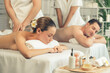 © InfiniteFlow - Caucasian couple customer enjoying relaxing anti-stress spa massage and pampering with beauty skin recreation leisure in day light ambient salon spa at luxury resort or hotel. Quiescent