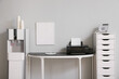 © Pixel-Shot - Modern water cooler and workplace near white wall in room