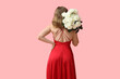 © Pixel-Shot - Beautiful young woman with bouquet of white roses on pink background, back view