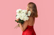 © Pixel-Shot - Beautiful young woman with bouquet of white roses on pink background