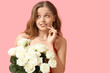 © Pixel-Shot - Thoughtful young woman with bouquet of white roses on pink background