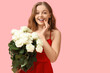 © Pixel-Shot - Beautiful happy woman with bouquet of white roses on pink background