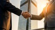© chamathjeewantha - Two Businessmen in Suits Sealing Successful Deal with Firm Handshake Against Modern City Skyline at Sunset