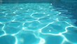 © Vadym - Clear blue pool water surface with bright sun reflections creating calming light patterns. Clean aquatic background for summer relaxation and swimming pool refreshment. Purity and tranquility.
