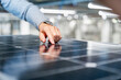 © Westend61 - Engineer inspecting solar panel in production hall